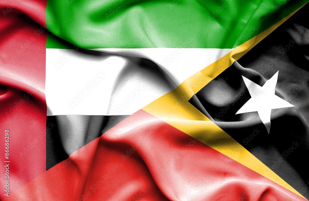 Waving flag of East Timor and United Arab Emirates Waving flag of East Timor and United Arab Emirates