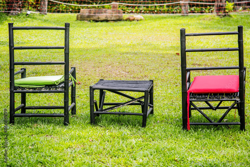 chairs on a green lawn chairs on a green lawn