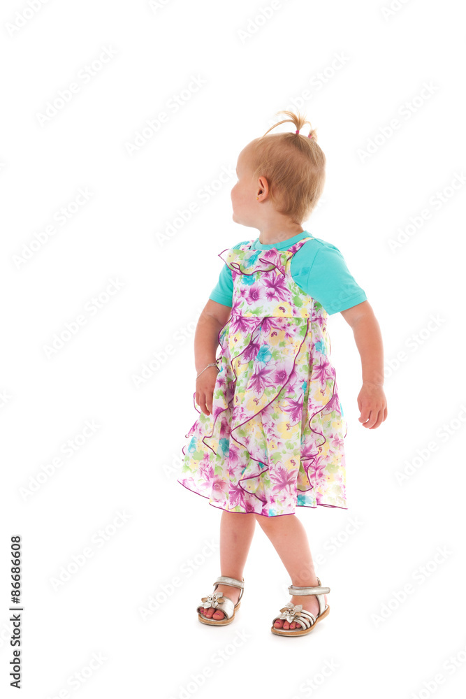 Toddler girl looking back