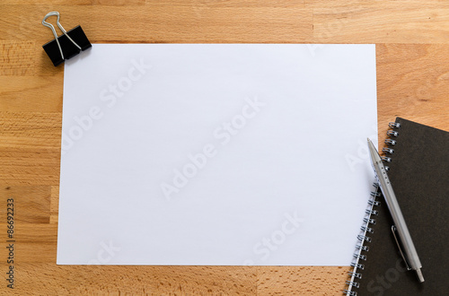 Working desk with plain paper for adding some information