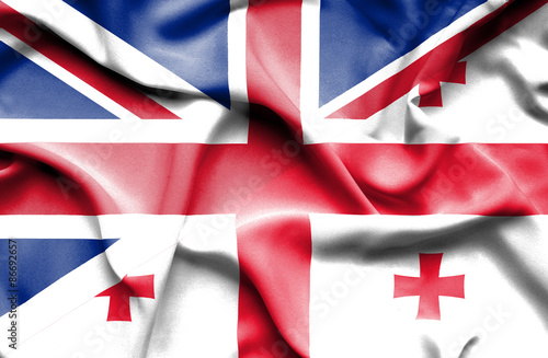 Waving flag of Georgia and Great Britain