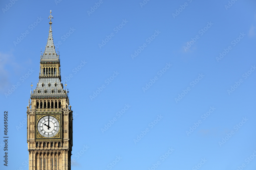 Big Ben London clock tower houses of parliament isolated against a deep blue sky