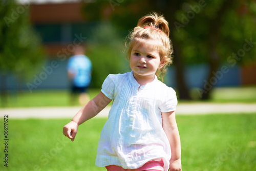 little girl have fun in park