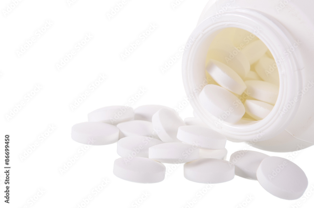 Pills spilling out of pill bottle Pills spilling out of pill bottle