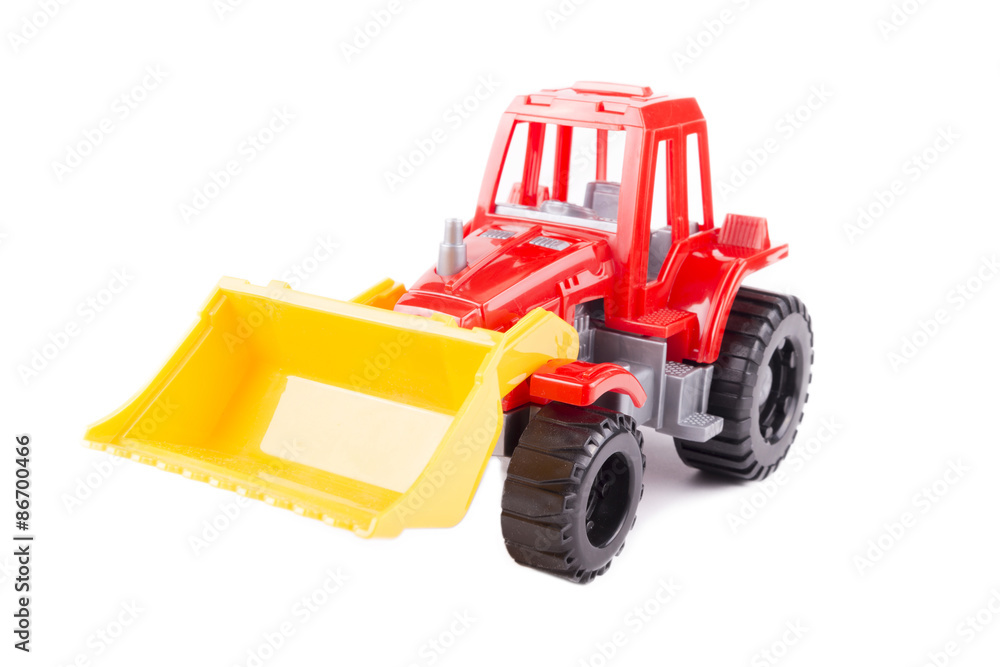 red toy tractor on a white background red toy tractor on a white background