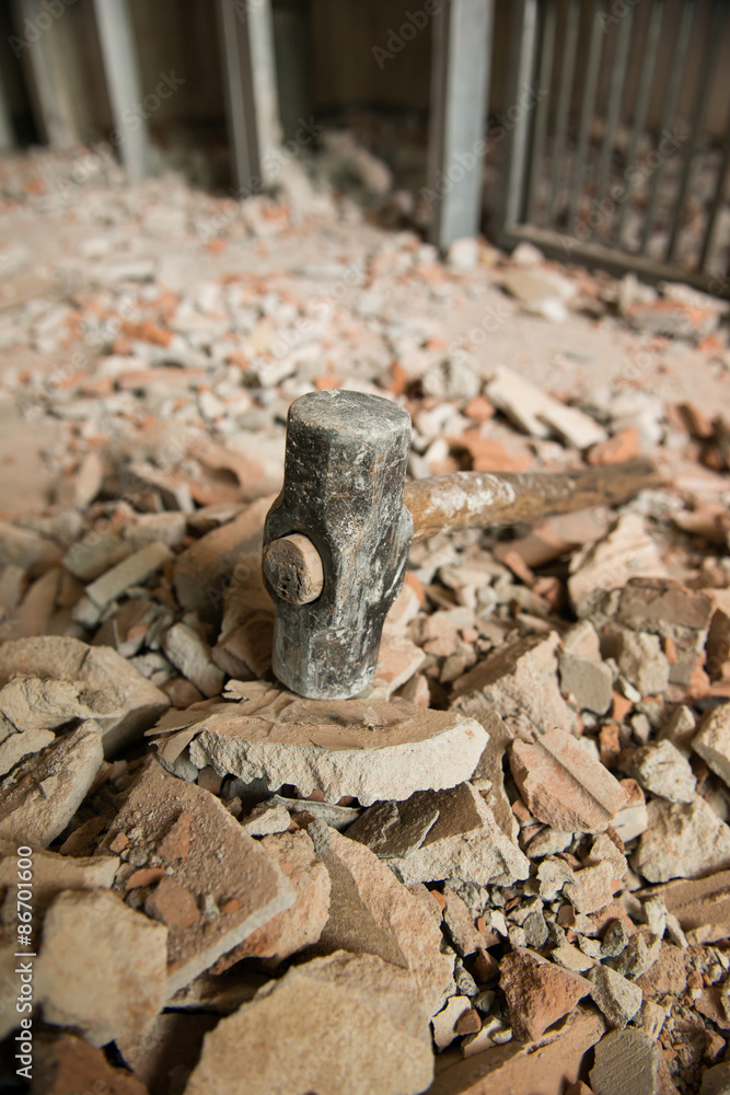 Fototapeta premium heavy hammer destroy the wall
