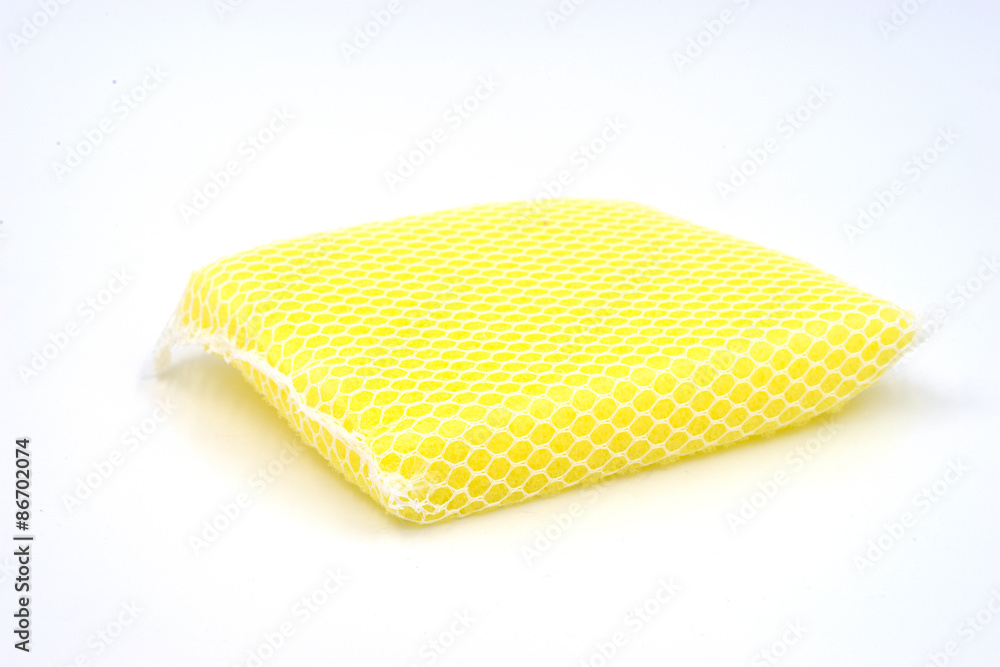 New yellow kitchen sponge on white background. New yellow kitchen sponge on white background.