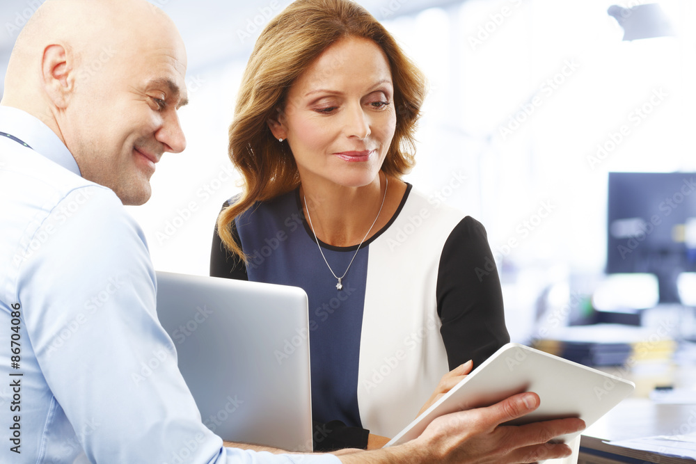 Job interview. Businesswoman and businessman working together on laptop at office Job interview. Businesswoman and businessman working together on laptop at office