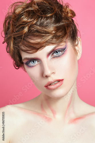 Close portrait of a beautiful girl with bright make-up