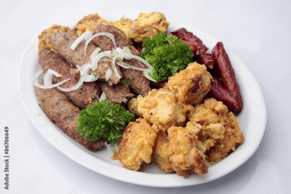 Grilled shish kebabs and sausages Grilled shish kebabs and sausages
