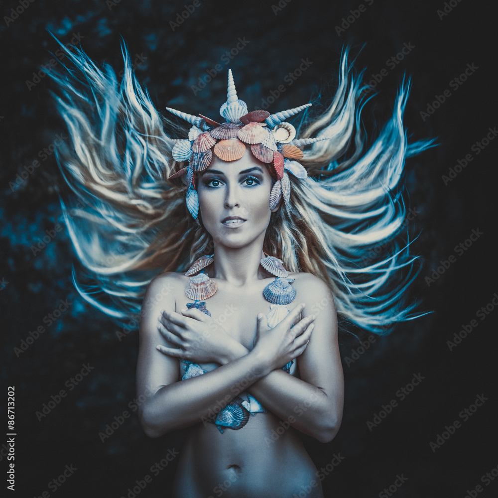 Obraz premium Fantasy photo of a young beautiful girl with curly hair