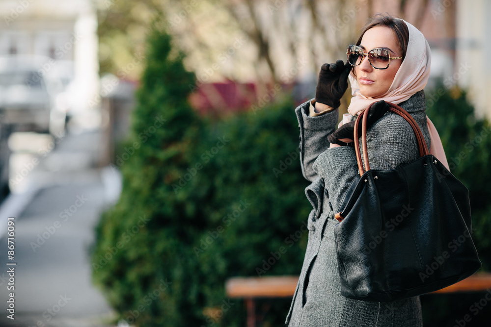 Fototapeta premium Happy young beautiful girl posing in the park