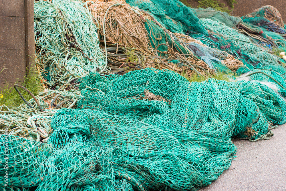 Fisher net background of ropes made of green nylon Fisher net background of ropes made of green nylon