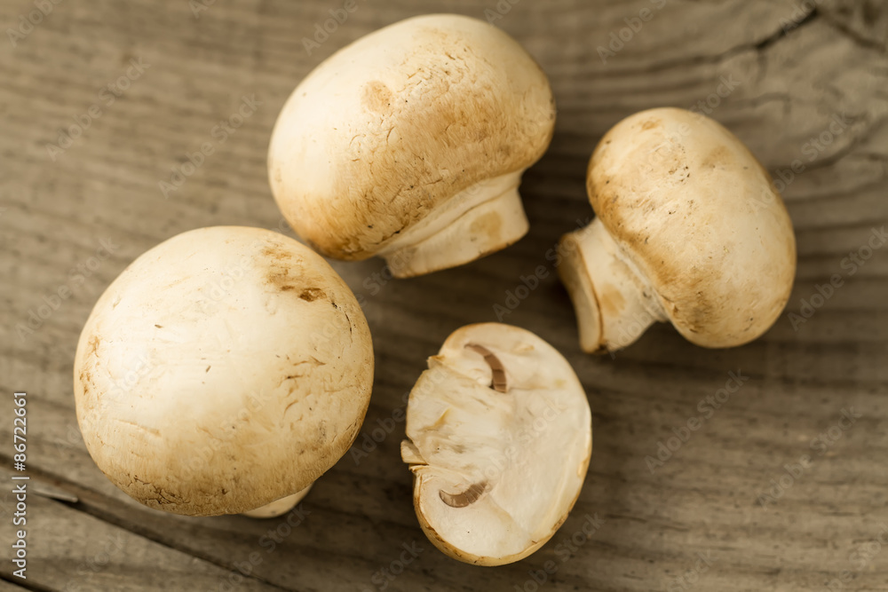 fresh mushrooms on wooden background, close-up fresh mushrooms on wooden background, close-up