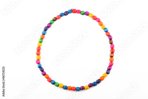 Colorful handmade wooden painted beads necklace isolated on whit