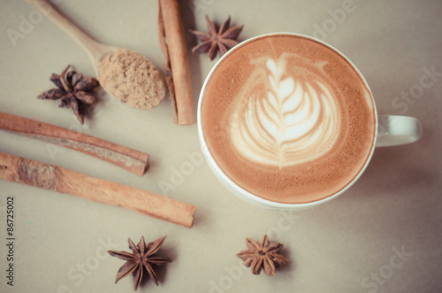 a cup of latte art on brow background, vintage coffee