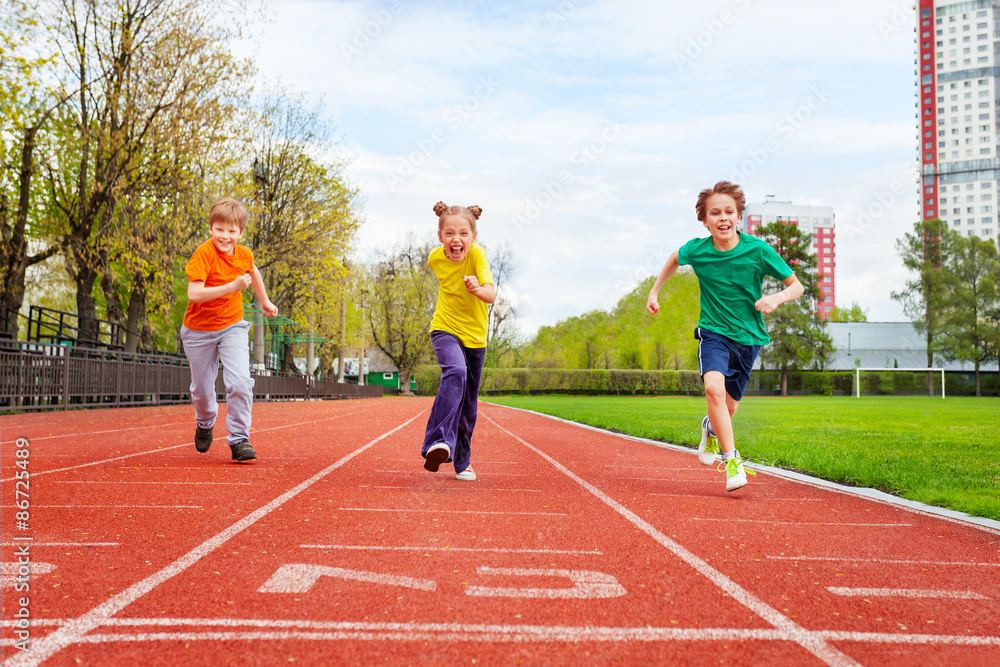 Children running the marathon on finish line