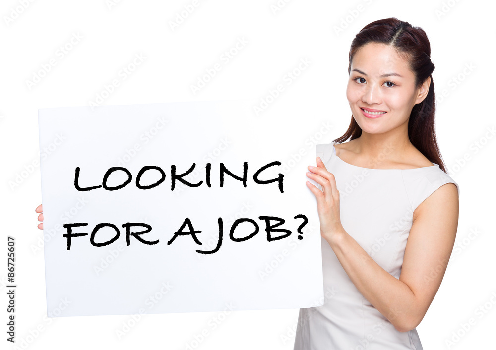 Asian woman holding with placard showing phrase of looking for a Asian woman holding with placard showing phrase of looking for a