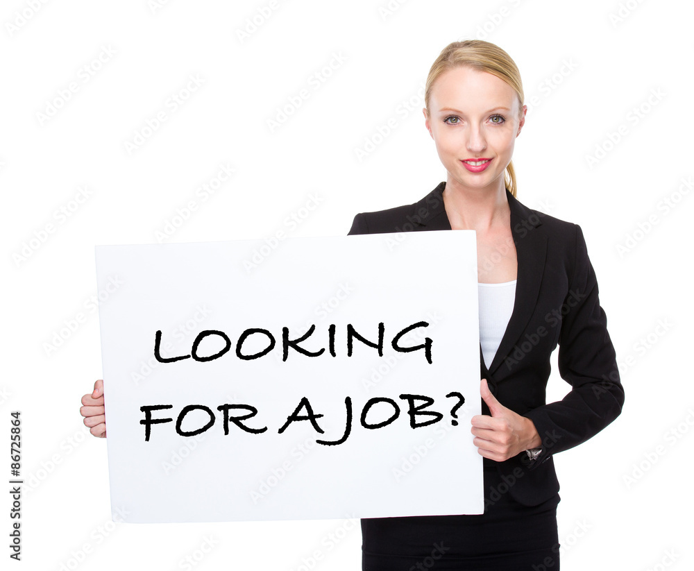 Caucasian businesswoman hold white board with phrase of looking Caucasian businesswoman hold white board with phrase of looking