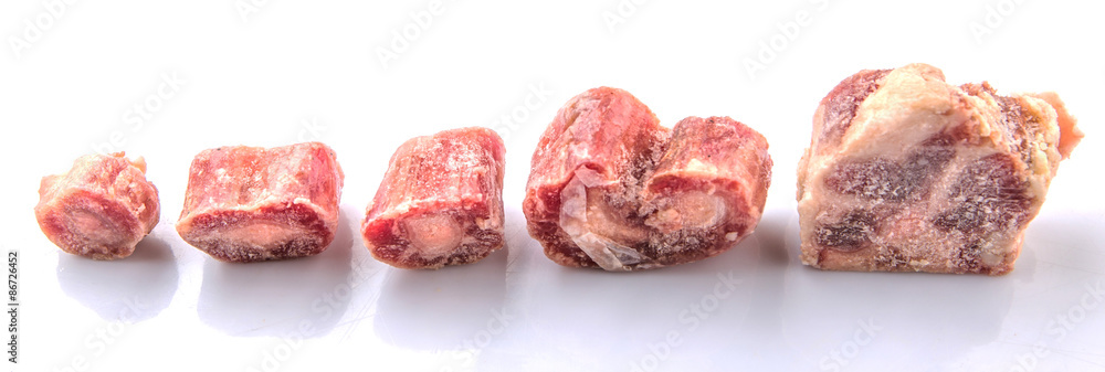 Raw frozen ox tail on white background Raw frozen ox tail on white background