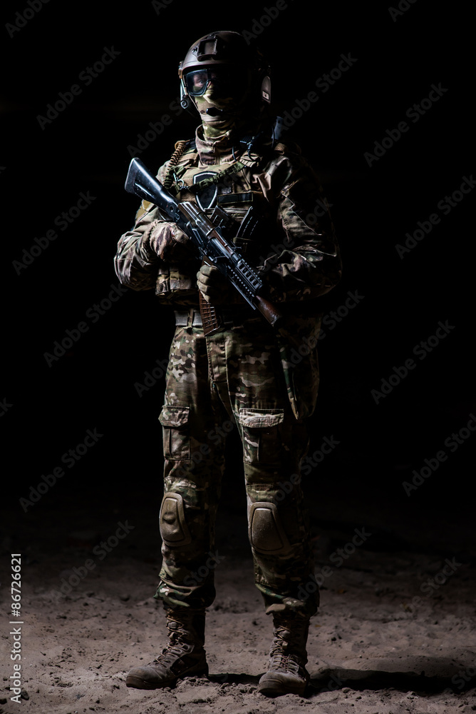 Man in military camouflage with a machine gun in hand Man in military camouflage with a machine gun in hand