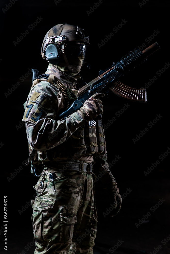 Soldier with machine gun on a black background Soldier with machine gun on a black background
