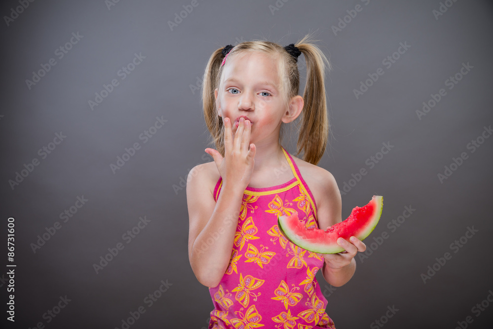 Little toothless girl eating watermelon. Little toothless girl eating watermelon.