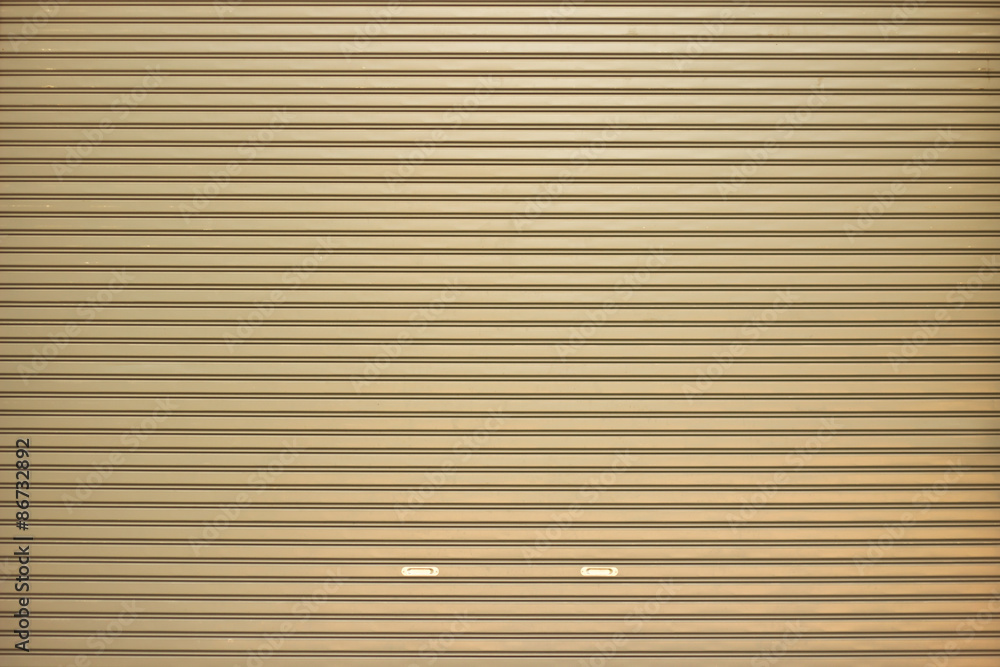 Close-up detail of closed metal security shutter Close-up detail of closed metal security shutter