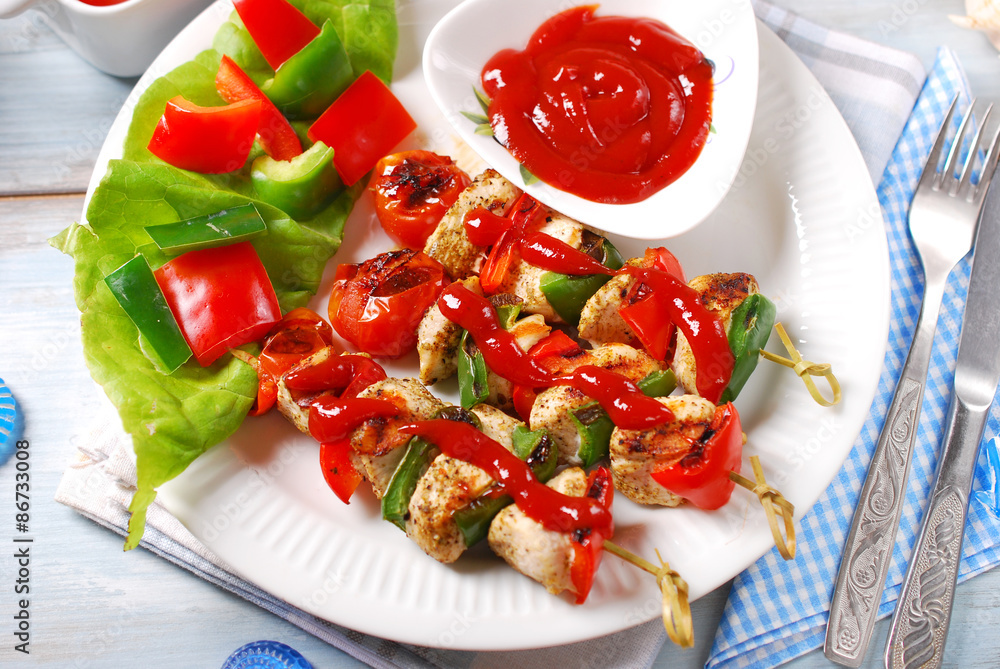 chicken and vegetable grilled skewers with ketchup