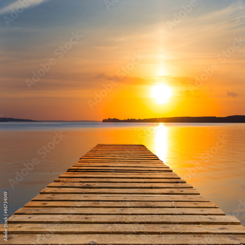 wooden wharf on a sunset