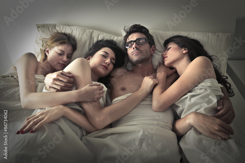 Man sleeping with three women photo