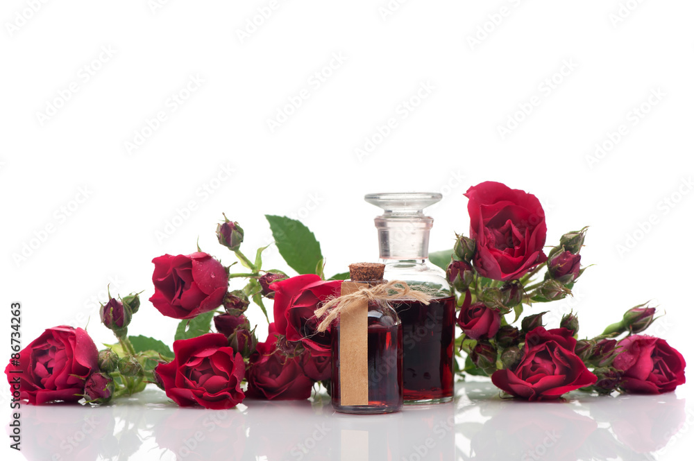 Rose oil and rose flowers. Spa and aromatherapy Rose oil and rose flowers. Spa and aromatherapy