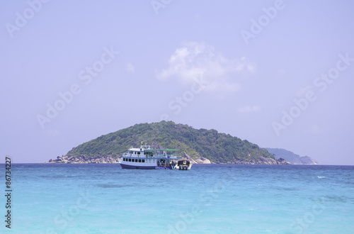 Sea and island with passenger ship on sea transfers for tourists © voraphong pirawd