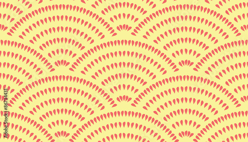 Vector seamless pattern with fish scale layout. Red teardrop-shaped elements on a yellow background.