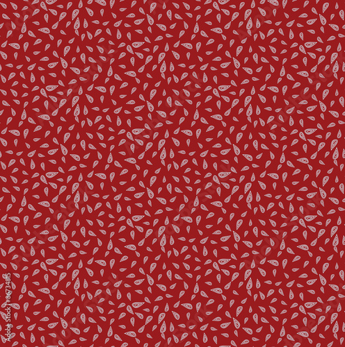 Vector seamless background consisting of random drops scattered in different directions. Chaotic drops on a red background.