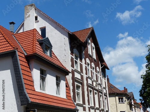 Häuserzeile mit schönen restaurierten Altbauten vor blauem Himmel im Sonnenschein im Stadtteil Schildesche in Bielefeld im Teutoburger Wald in Ostwestfalen-Lippe photo