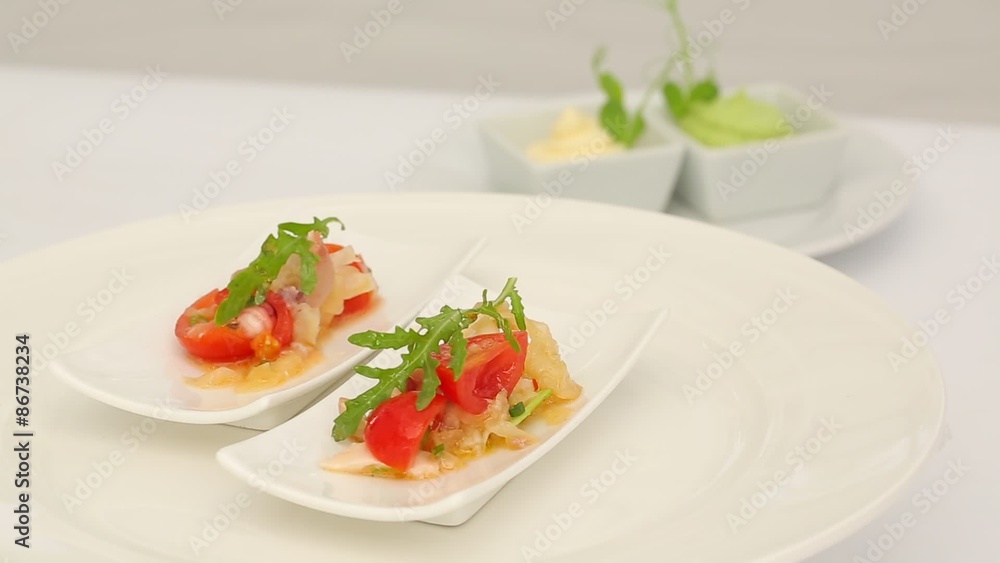 appetizer buffet style octopus, tomatoes, arugula, onion, cheese appetizer buffet style octopus, tomatoes, arugula, onion, cheese
