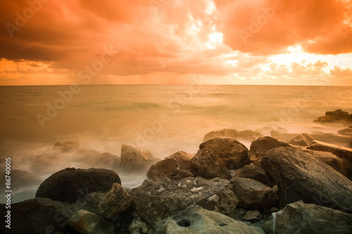 Bad weather. Stormy weather on the stone coast during a fiery or