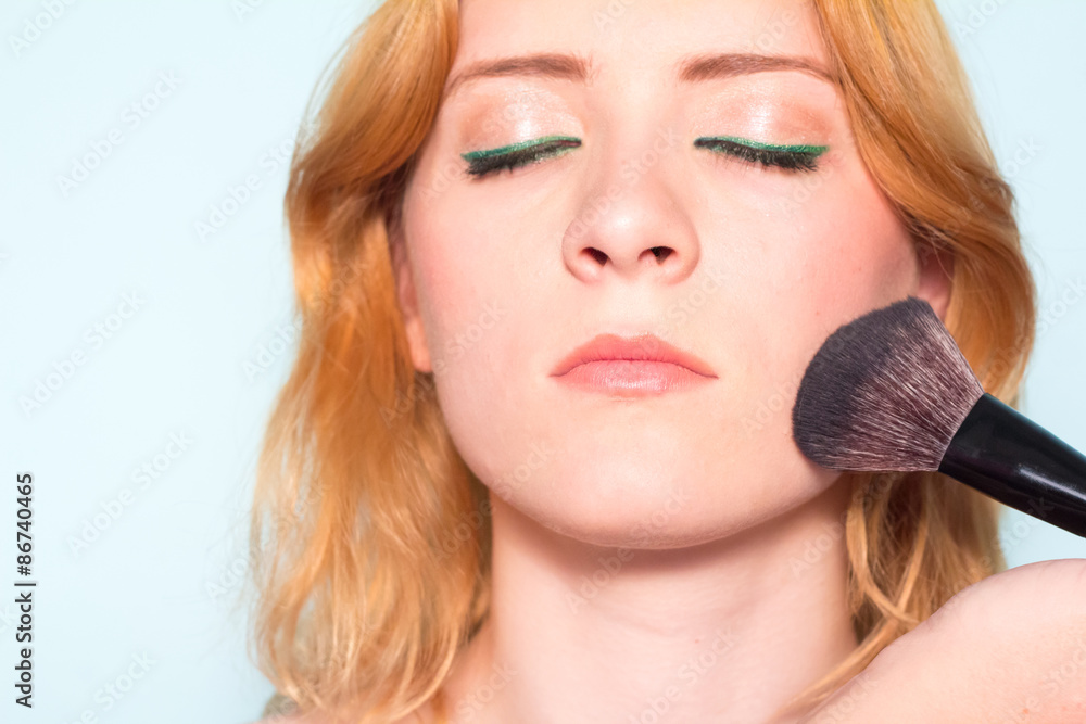 Makeup artist paints a woman blush cheekbones. Makeup. Makeup artist paints a woman blush cheekbones. Makeup.