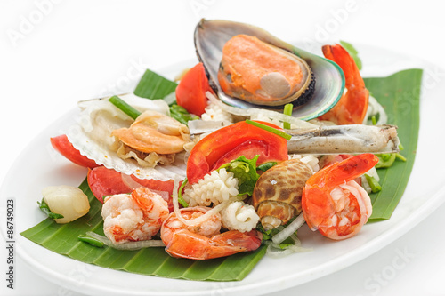 Seafood cocktail with mussels and shrimps isolated on white.