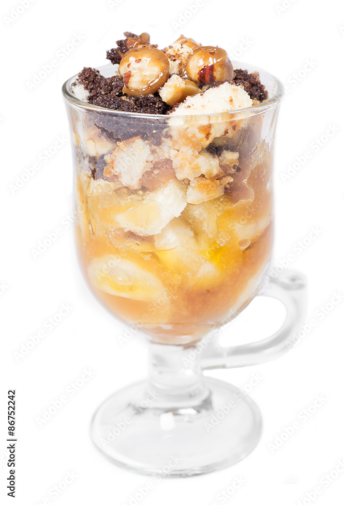 Delicious dessert with banana and caramel isolated on white Delicious dessert with banana and caramel isolated on white