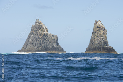 Steep rocky cliffs in remote ocean Tasmania