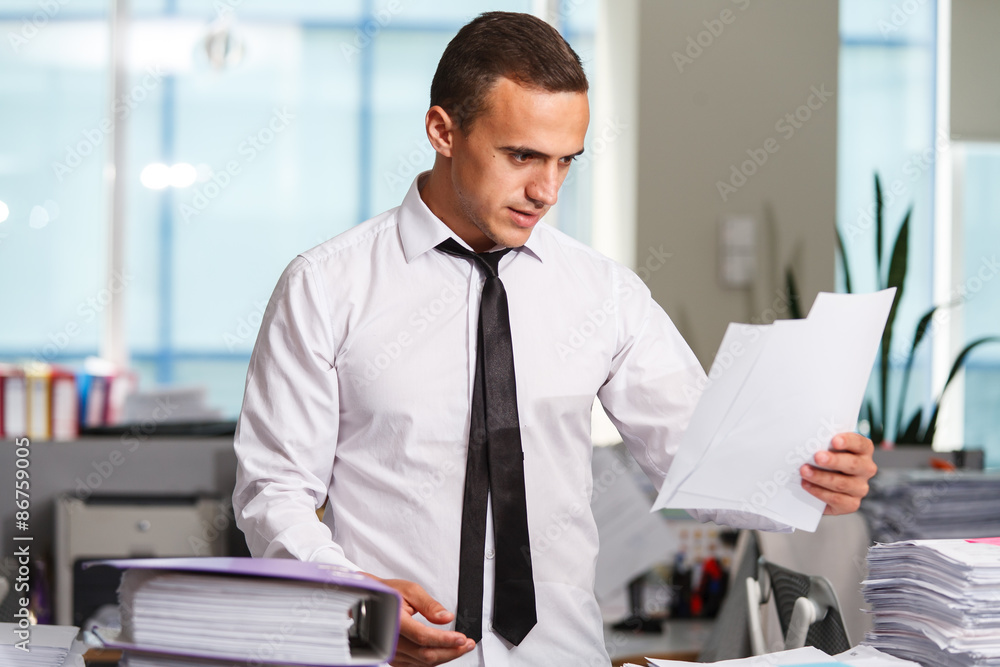 Stressful manager have so many paperwork in the office Stressful manager have so many paperwork in the office
