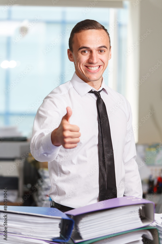 Happy office worker works with folders of paper Happy office worker works with folders of paper