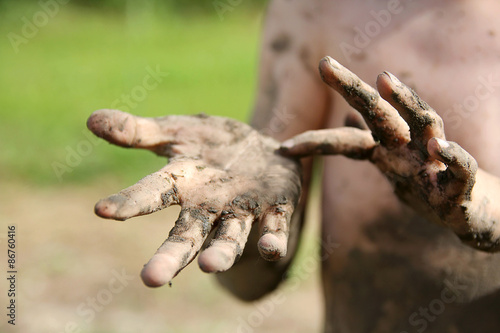 Close up on Muddy Hands of Little Boy