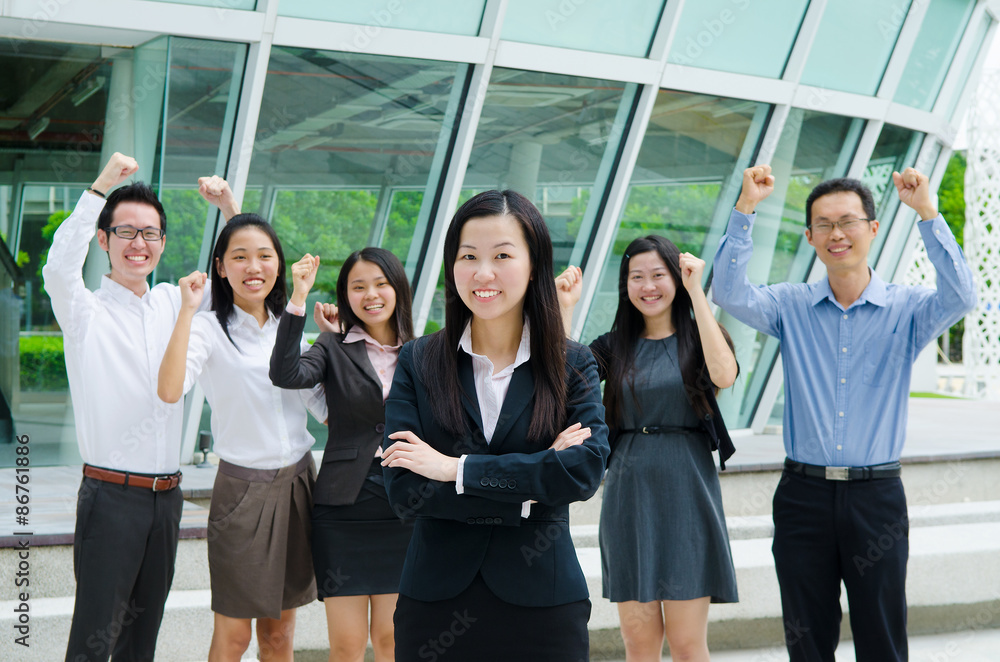 Asian business team overjoyed with their success Asian business team overjoyed with their success
