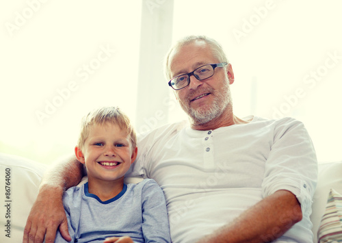 smiling grandfather and grandson at home © Syda Productions