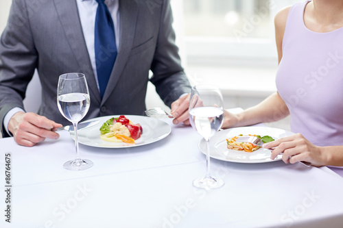 close up of couple eating appetizers at restaurant © Syda Productions
