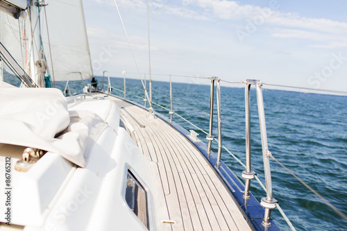 close up of sailboat or sailing yacht deck and sea