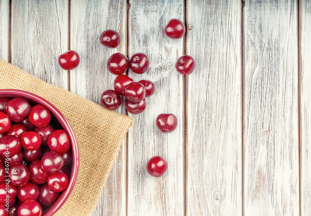 fresh cherries on wooden table fresh cherries on wooden table
